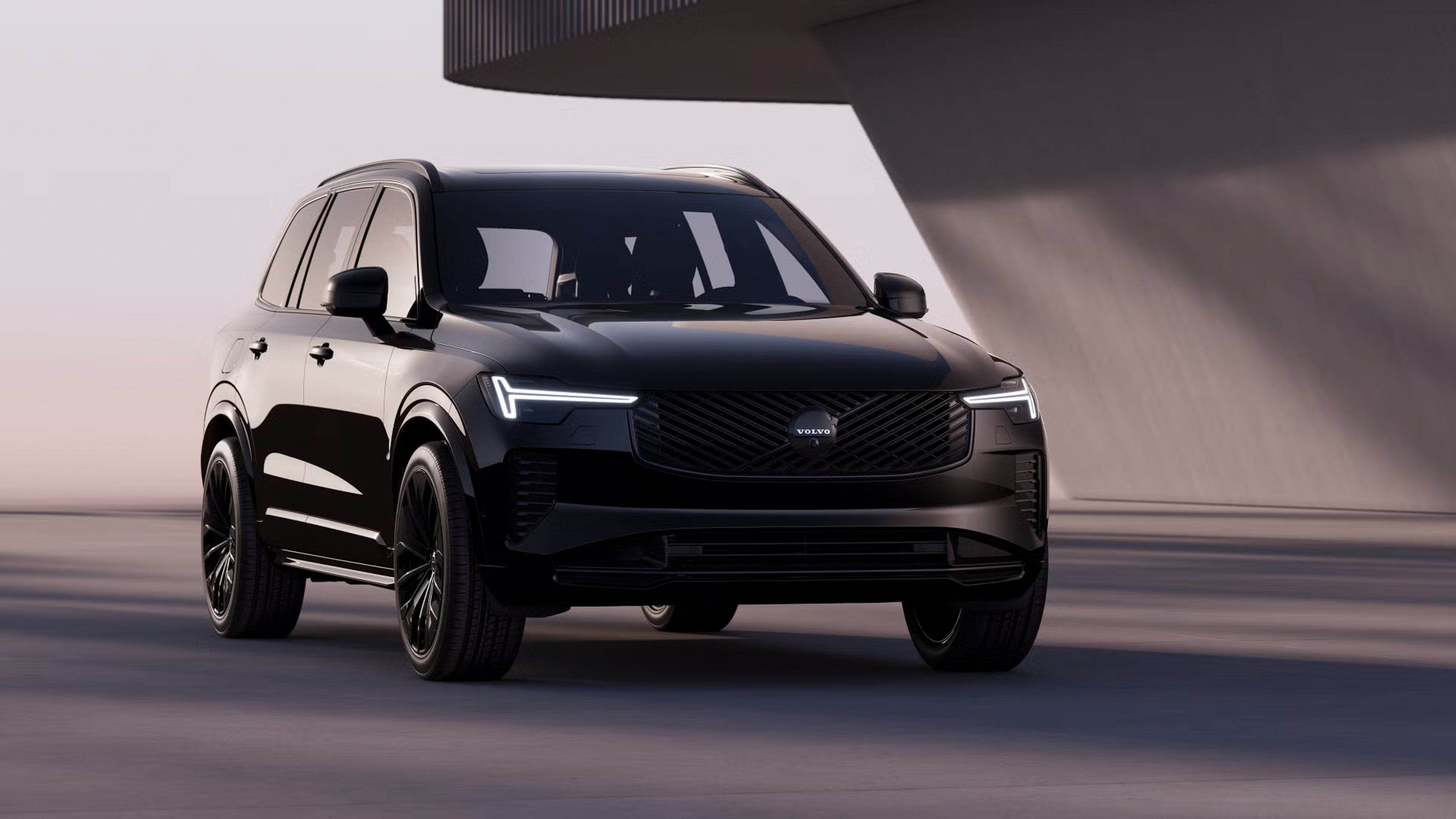 XC90 Black Edition parked in front of angular grey building