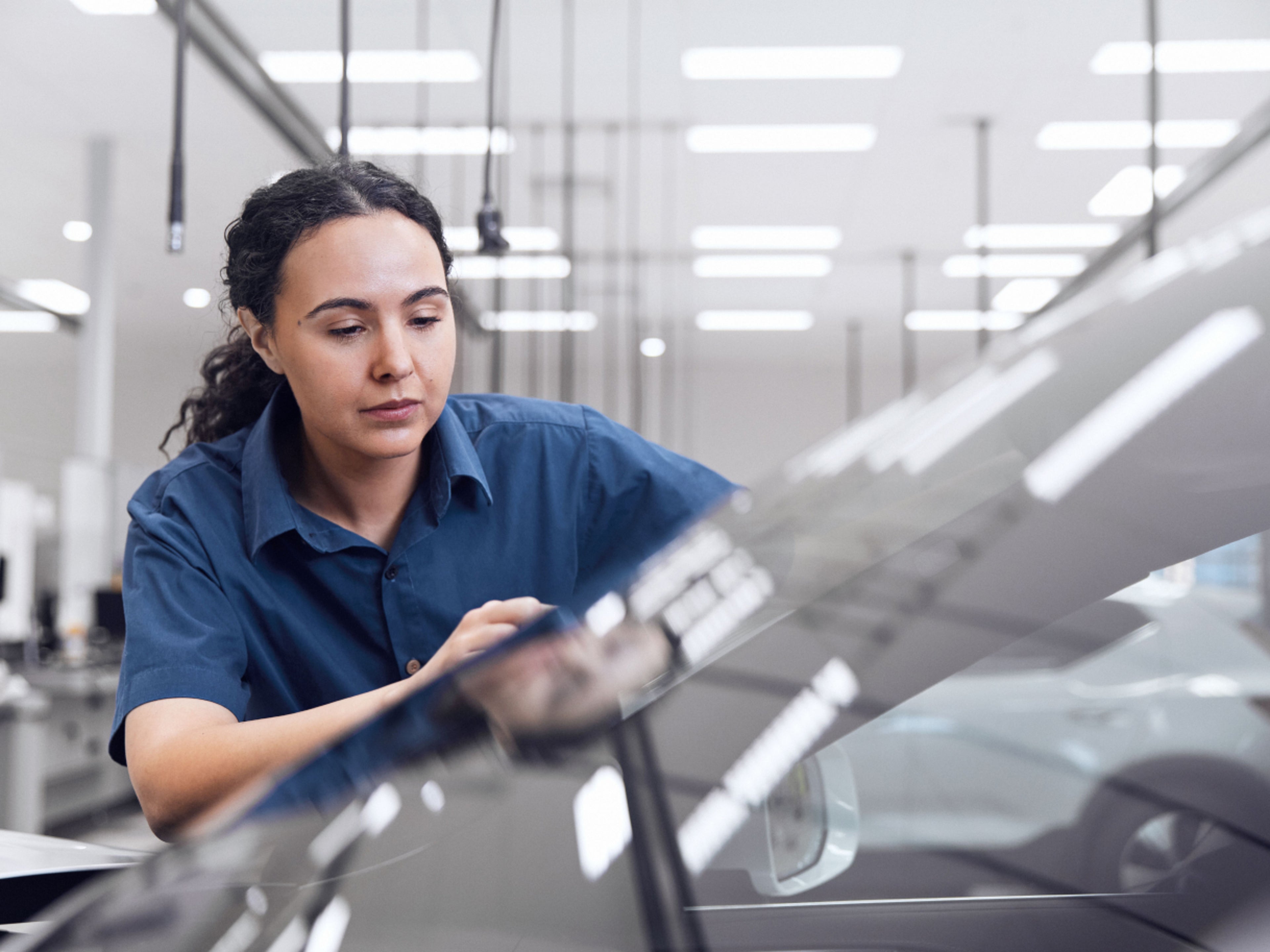 Volvo service technician inspecting the car.
