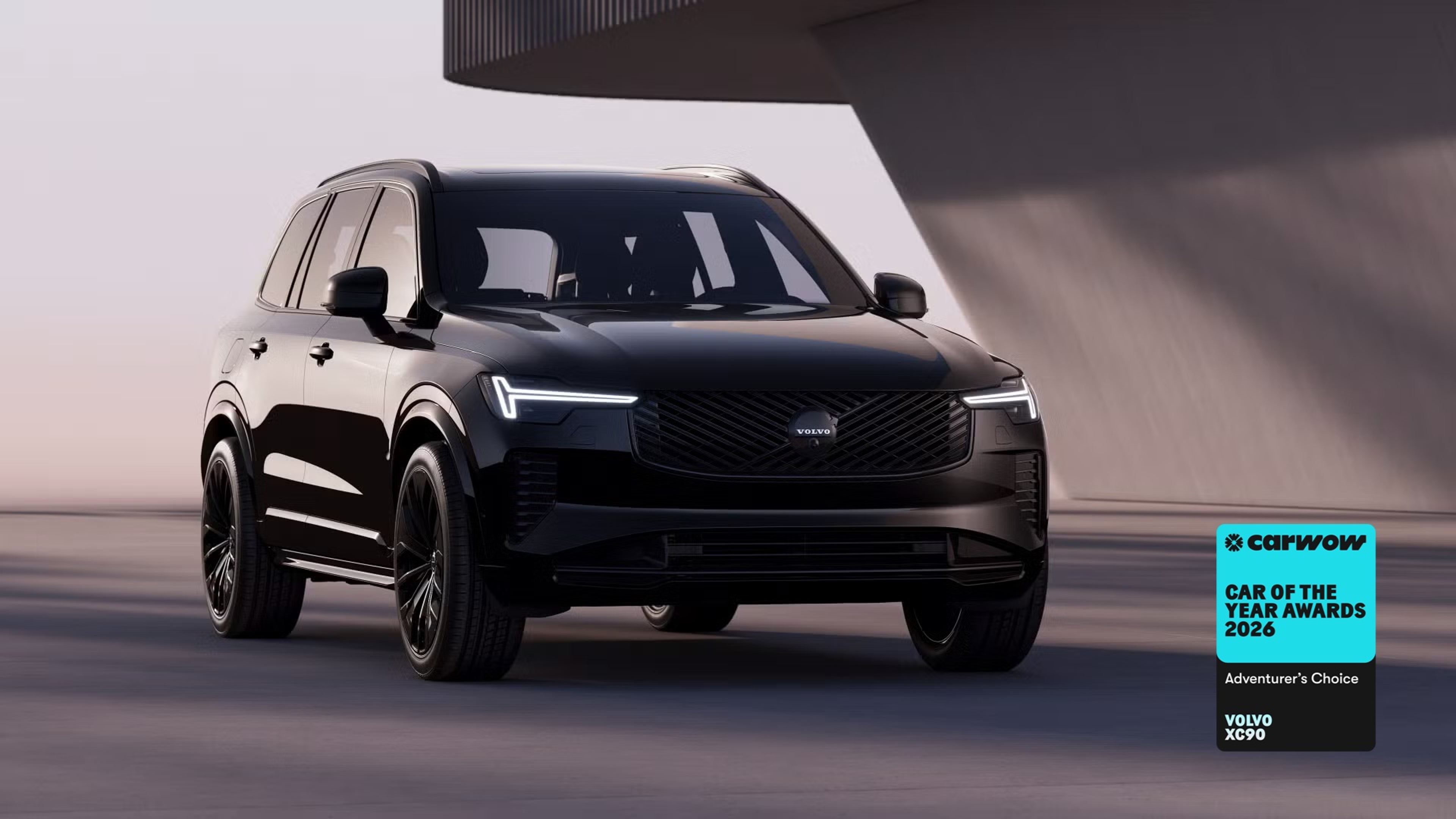 XC90 Black Edition parked in front of angular grey building