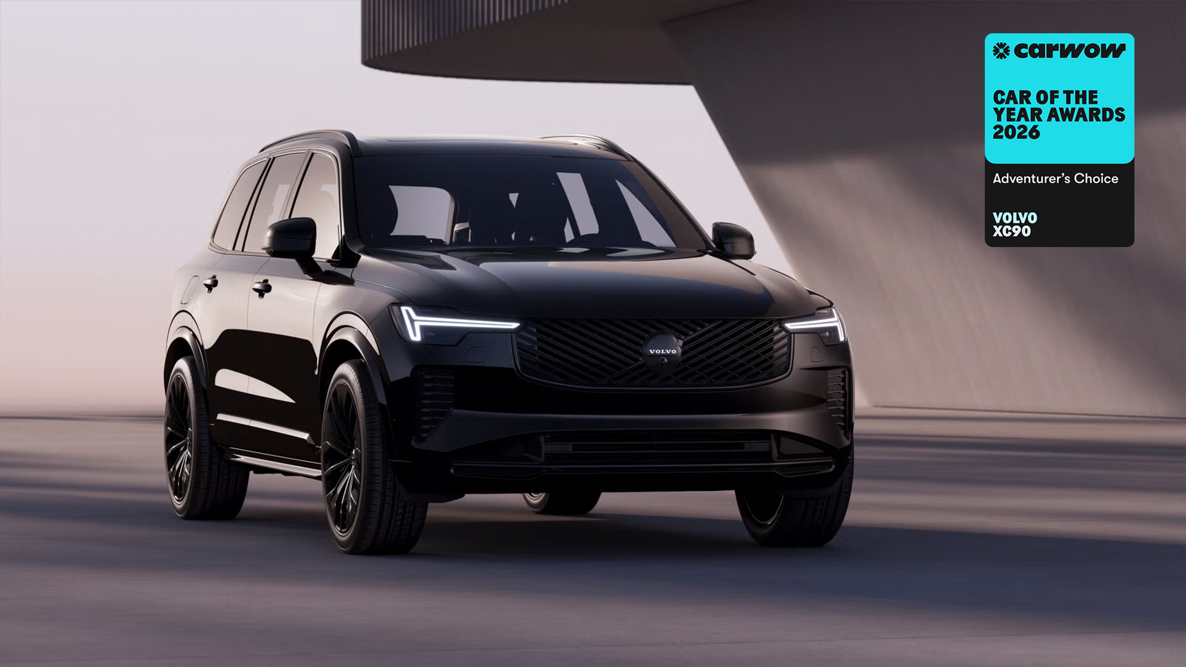 XC90 Black Edition parked in front of angular grey building