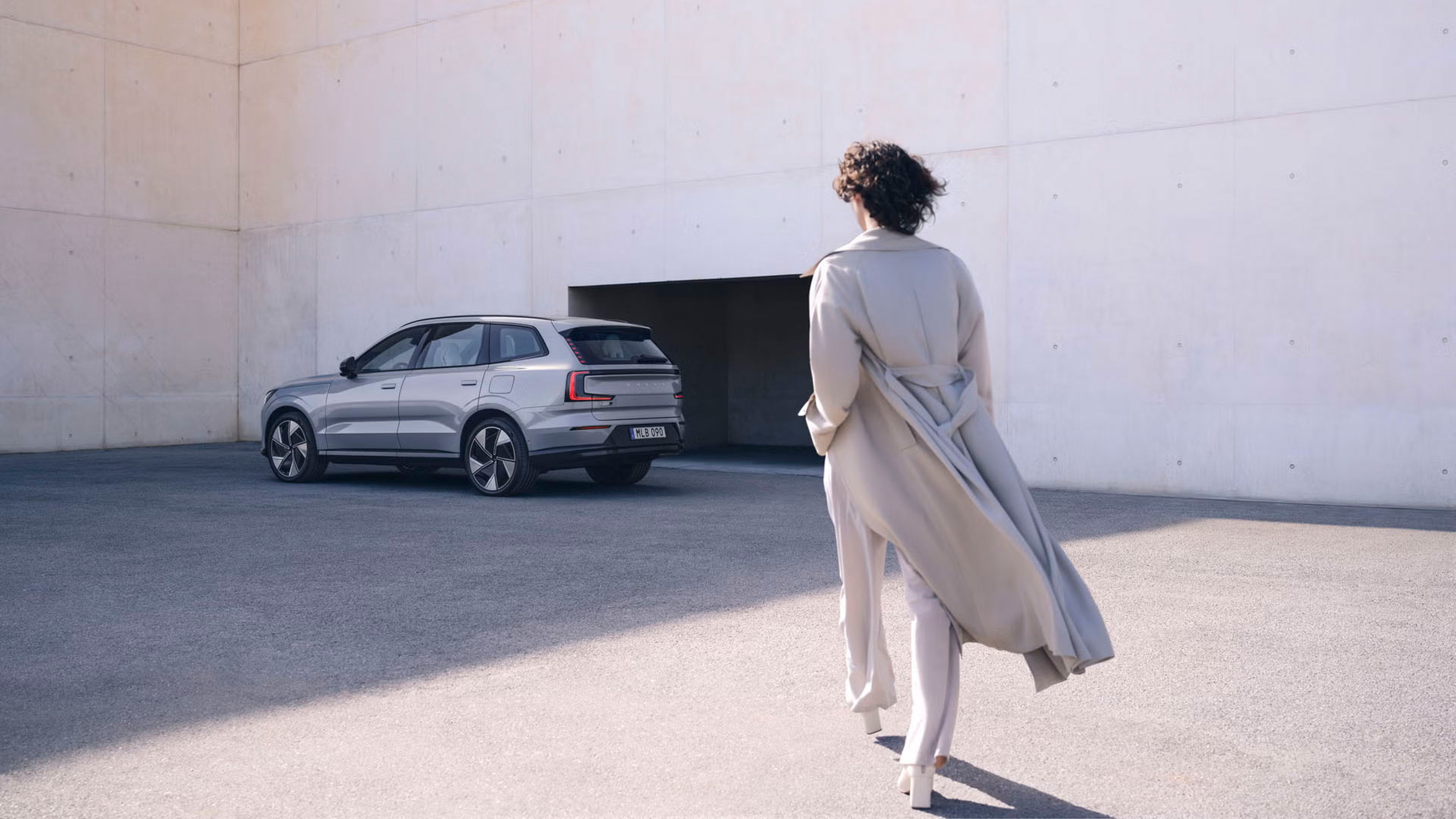 Woman walking towards EX90