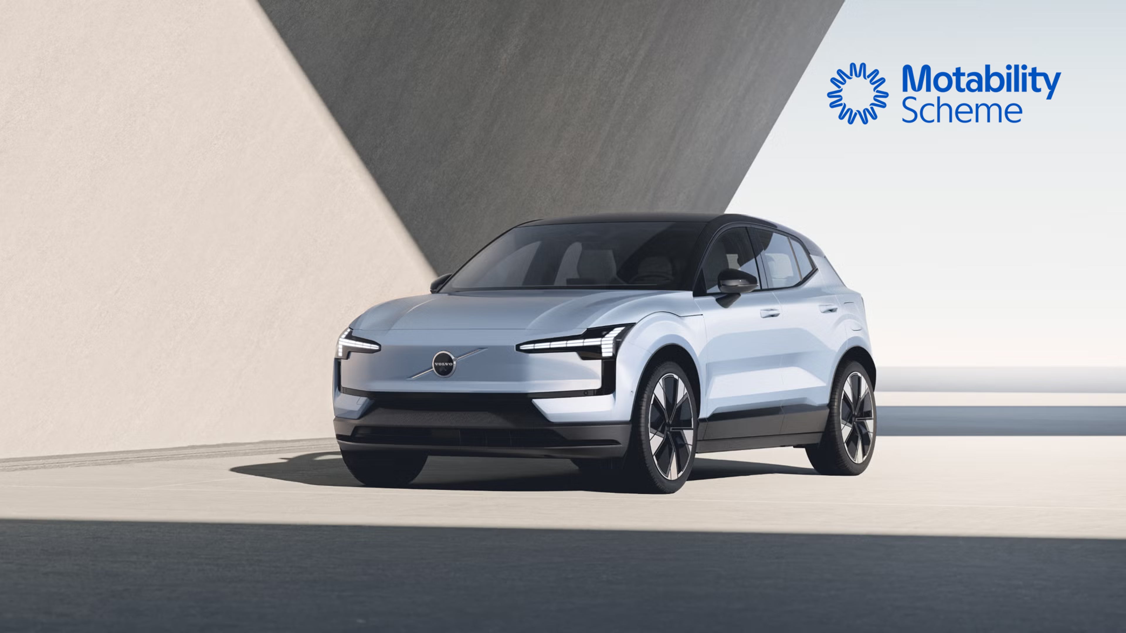 EX30 parked in front of angular background, bathed in daylight