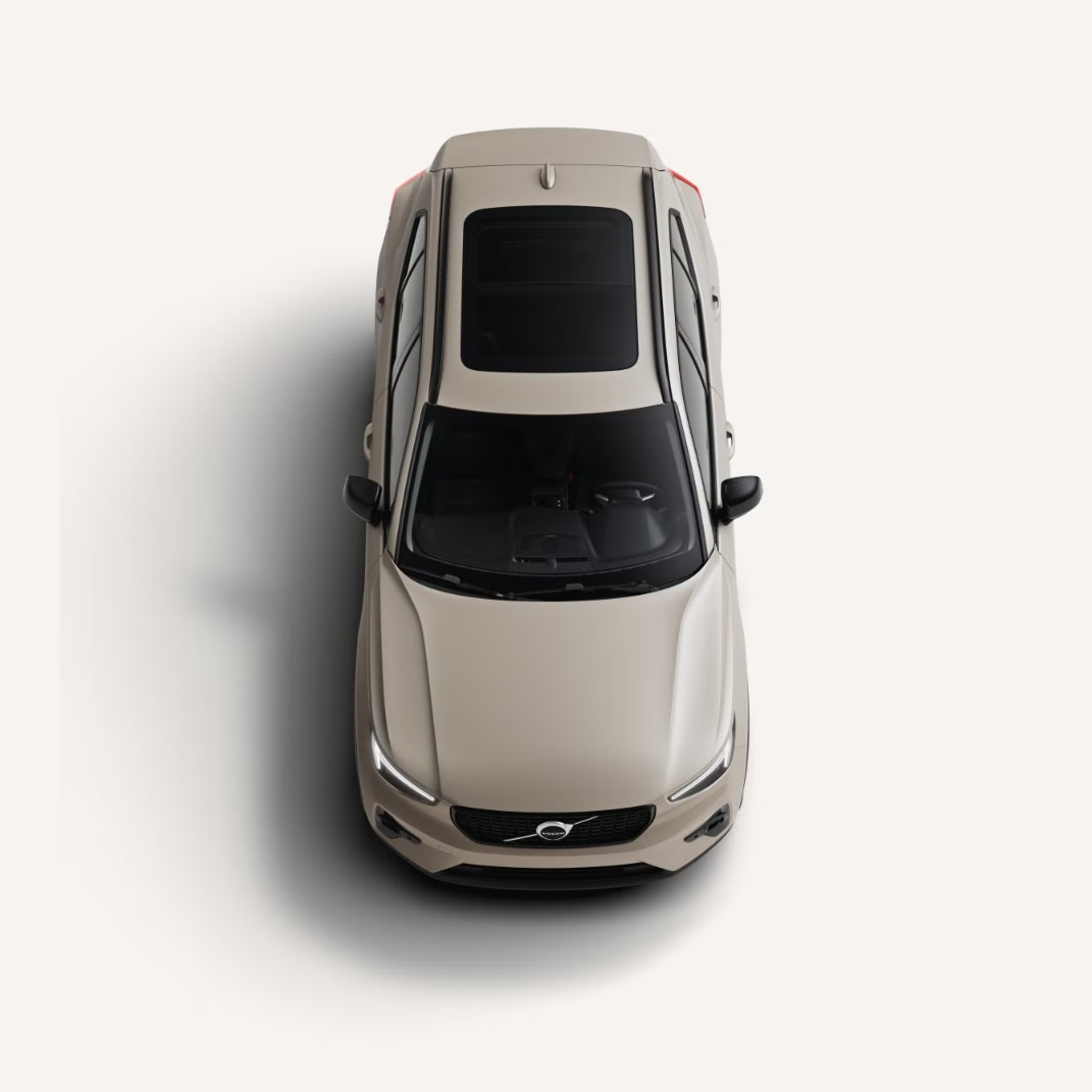 Birds eye view of the XC40 on a pale grey surface.