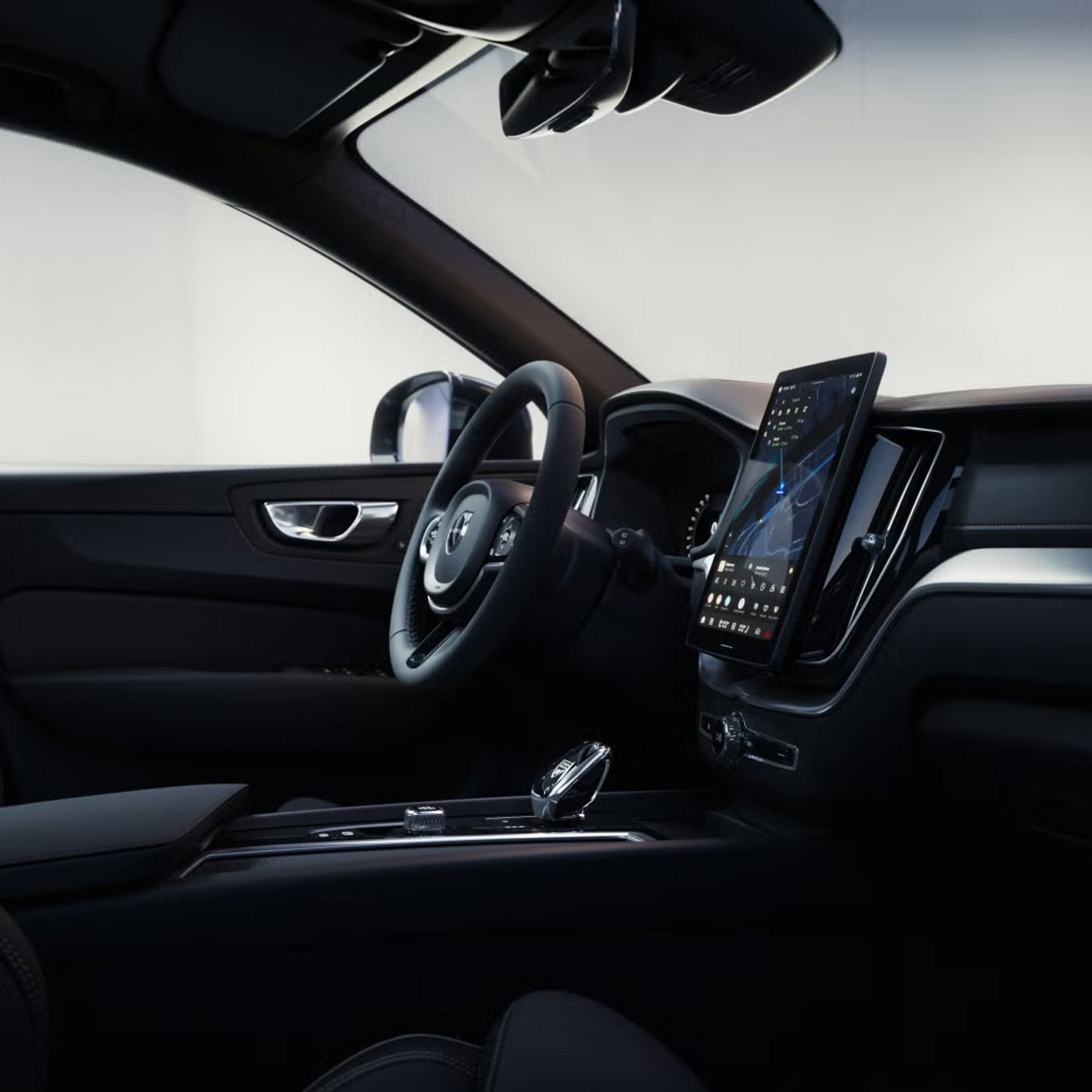 Close up of XC60 plug-in hybrid black edition steering wheel and dashboard