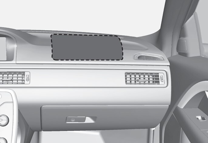 Localização do airbag do lado do passageiro da frente em modelos com volante à esquerda.