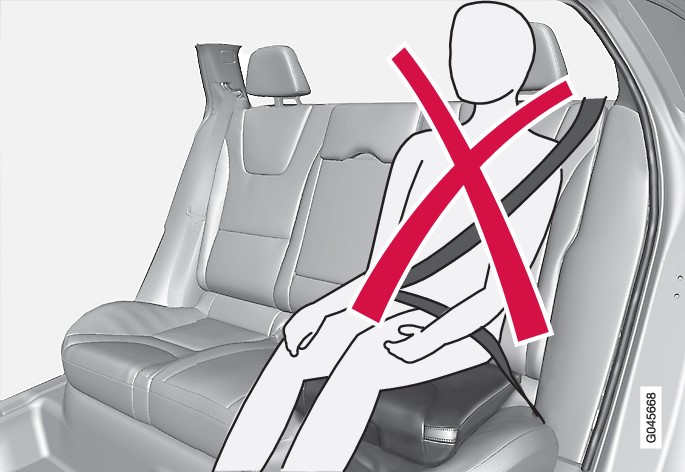 Incorrect position, the head restraint must be adjusted as high as the head and the seatbelt must not be below the shoulder.