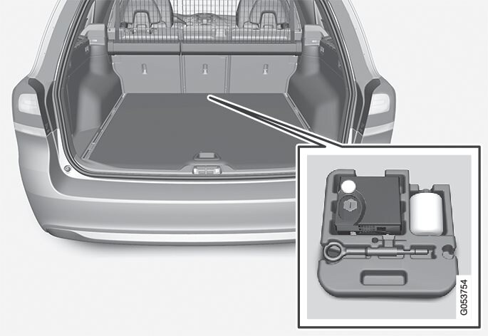 O kit de reparação de emergência de pneus furados encontra-se no compartimento de arrumos na secção dianteira do compartimento da carga.