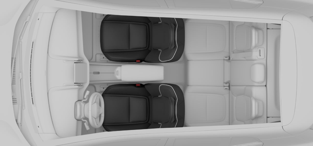 Top-down view of the car with front seats in focus.