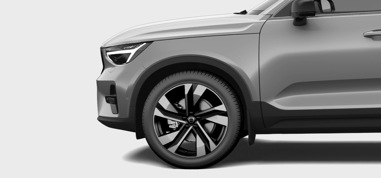 Side view of the car front and tyre.