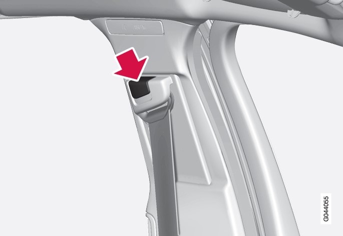Seatbelt height adjustment. Press the button and move the belt vertically. Position the belt as high as possible without it chafing against your throat.