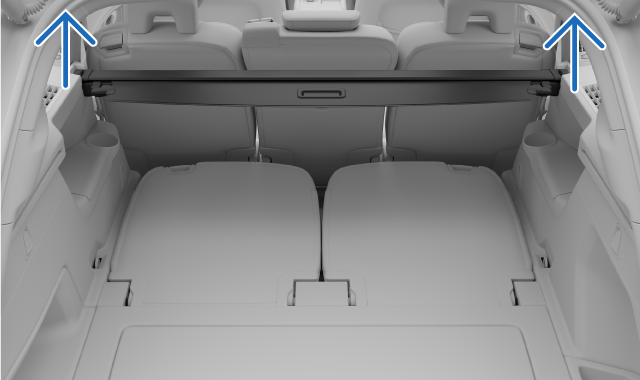 Soulever les extrémités du cache-bagages.