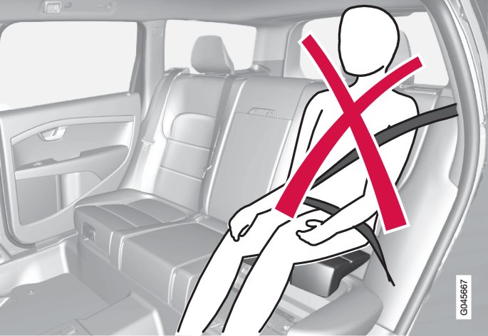Incorrect position, the head must not be positioned above the head restraint and the seatbelt must not be below the shoulder.