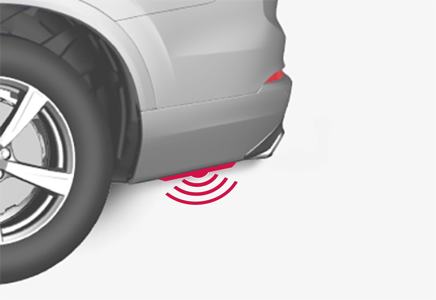 If the car is equipped with the skid plate/diffuser accessory, then the detector is positioned out towards the left-hand corner of the bumper.