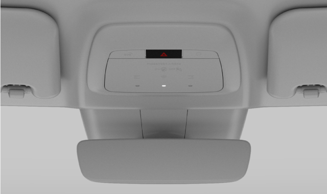 The location of the hazard lights button in the overhead console