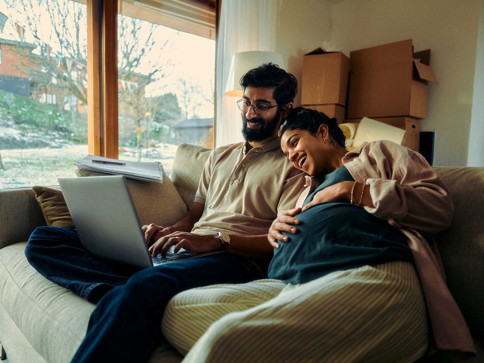 Mother and father looking at a laptop