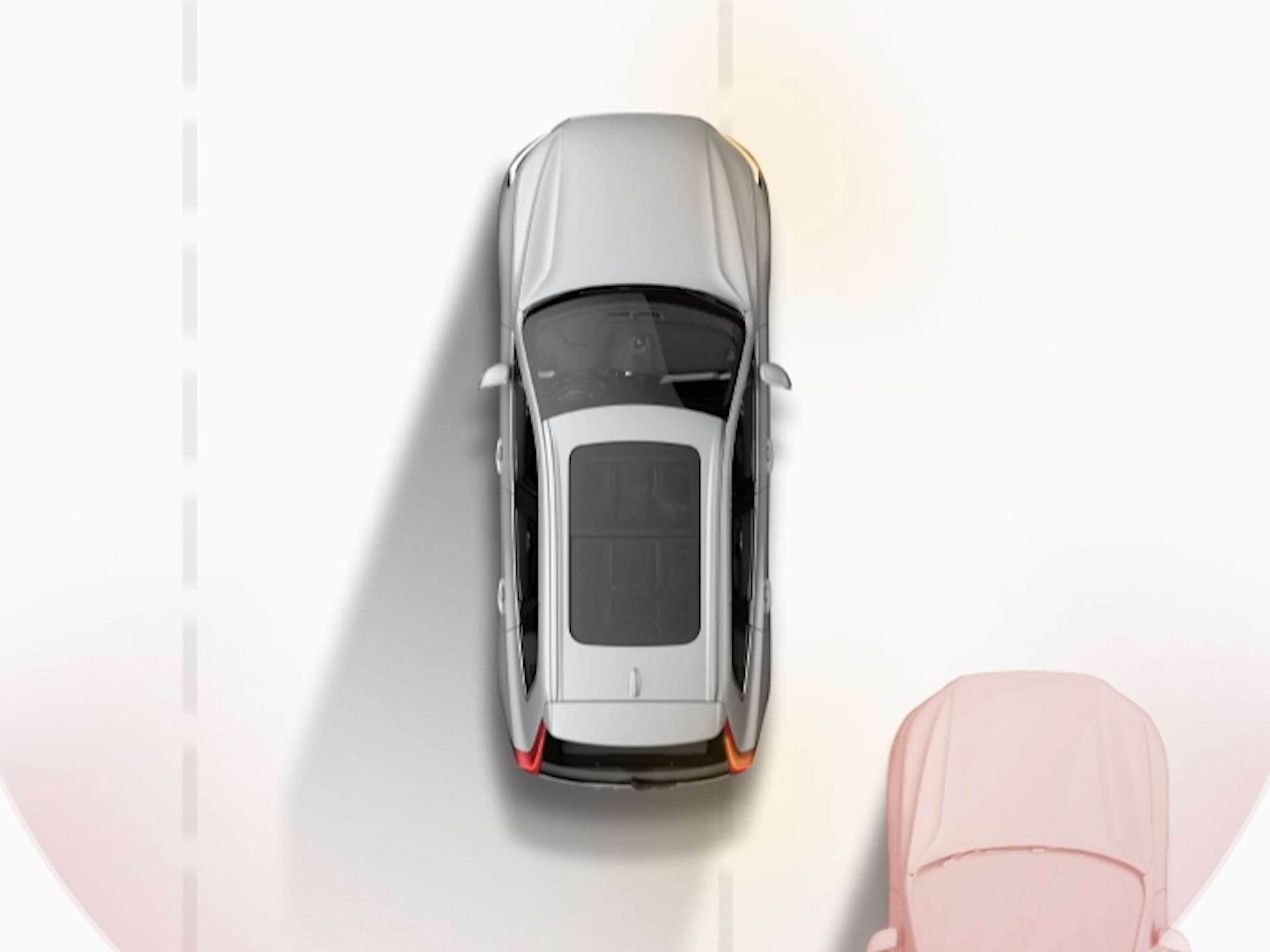 Ilustrace vozu Volvo jedoucího vedle jiných vozidel při pohledu shora.