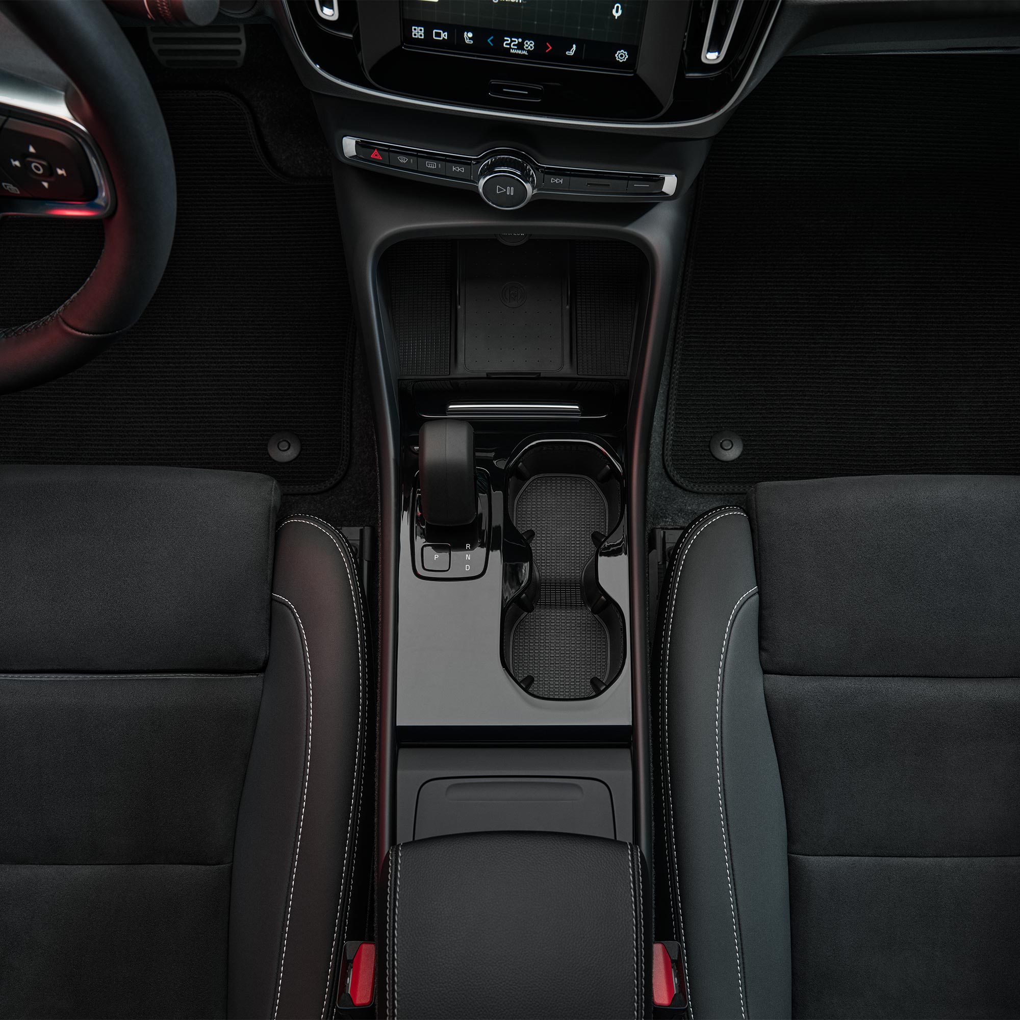 Volvo C40 Recharge cupholders and front seat storage.