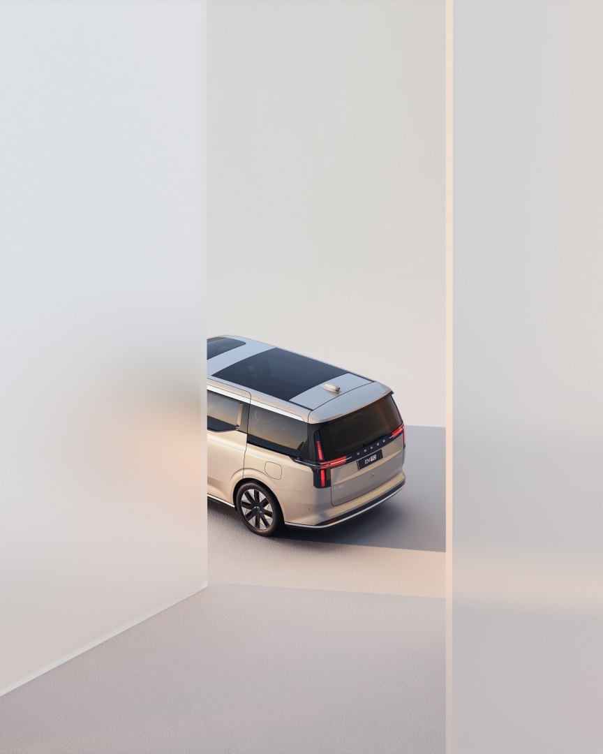 The 6-seater fully electric premium EM90 MPV viewed from the rear and slightly above in an neutral studio environment.