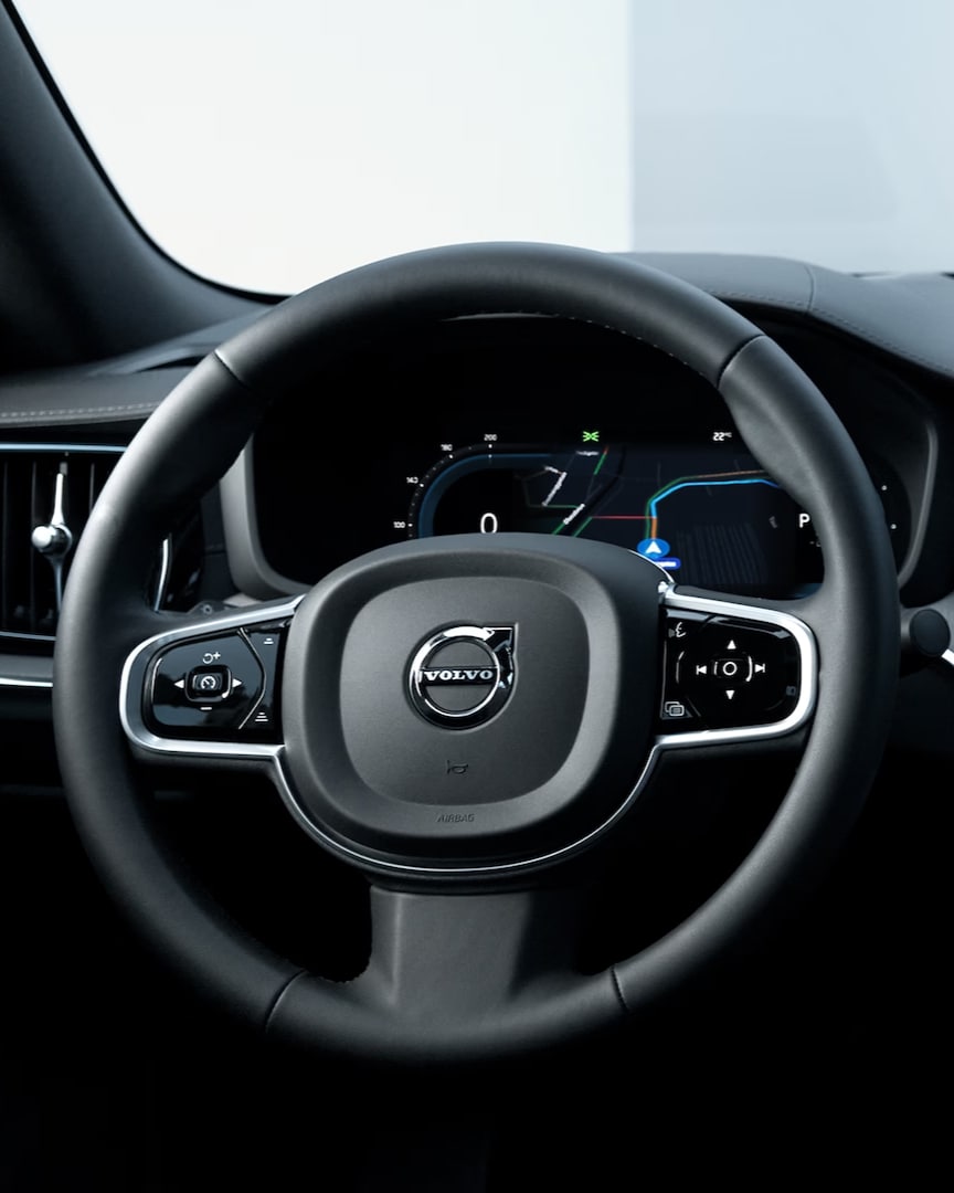 Driver’s view of the Volvo S60 Recharge plug-in hybrid’s steering wheel, instrument panel, vents and infotainment touchscreen.