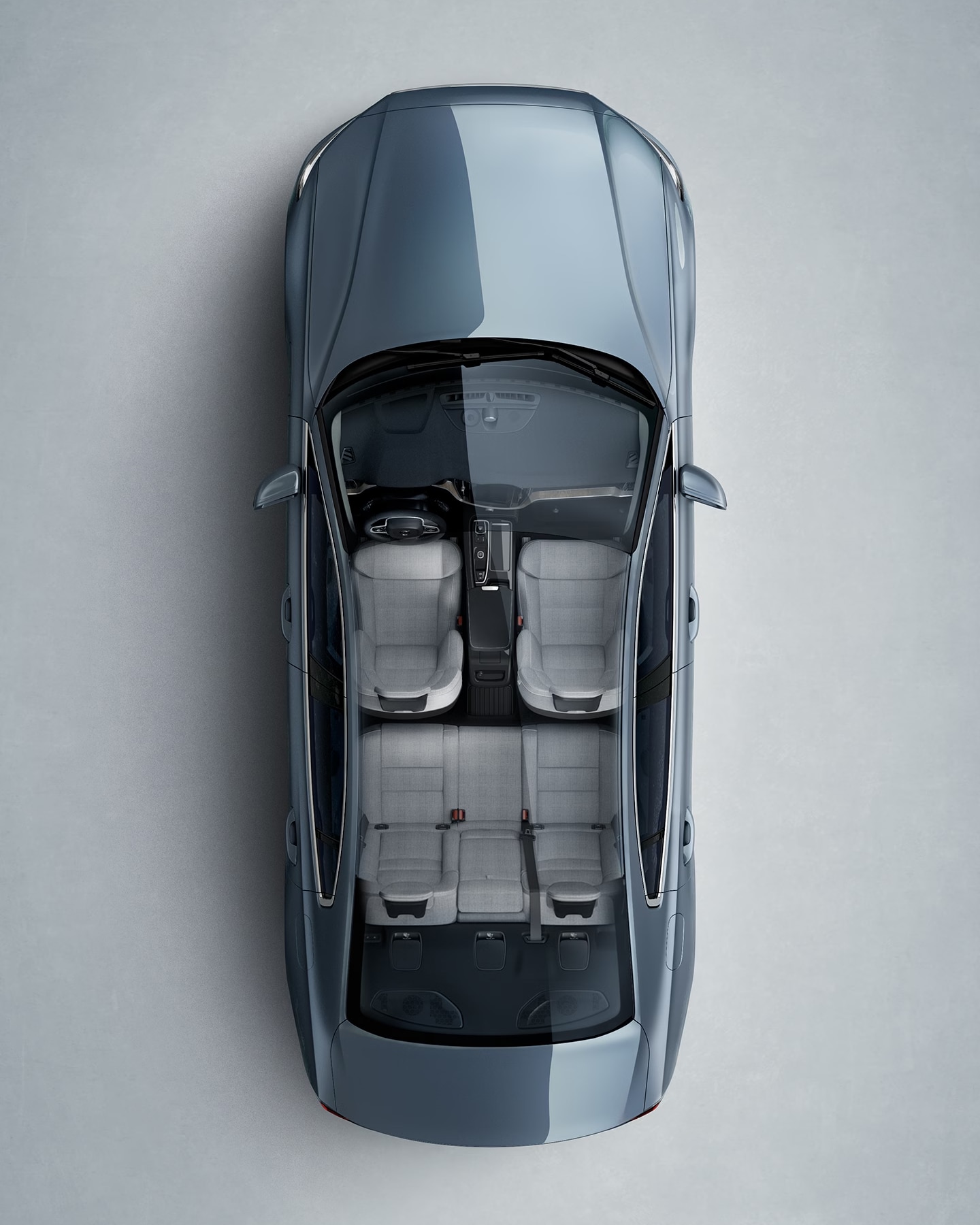 A blue Volvo S60 Recharge seen from directly above with interior visible.