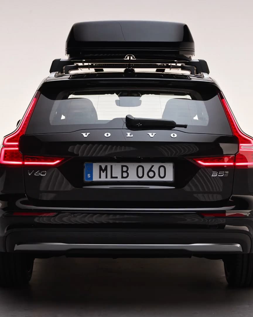 Exterior rear view of the Volvo V60 Cross Country, roof box and LED rear lights.