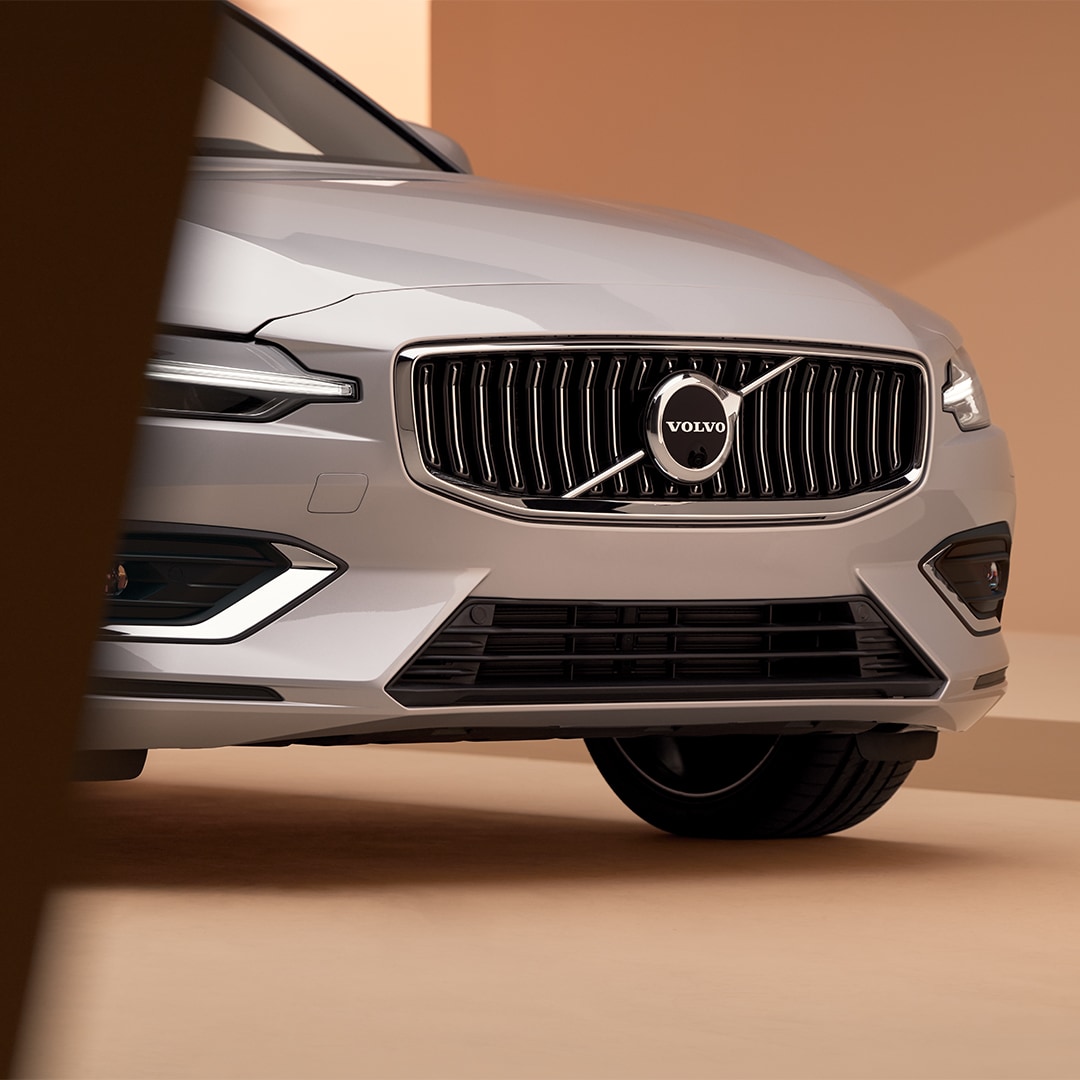 Front and side exterior of the Volvo V60 mild hybrid with signature grill.
