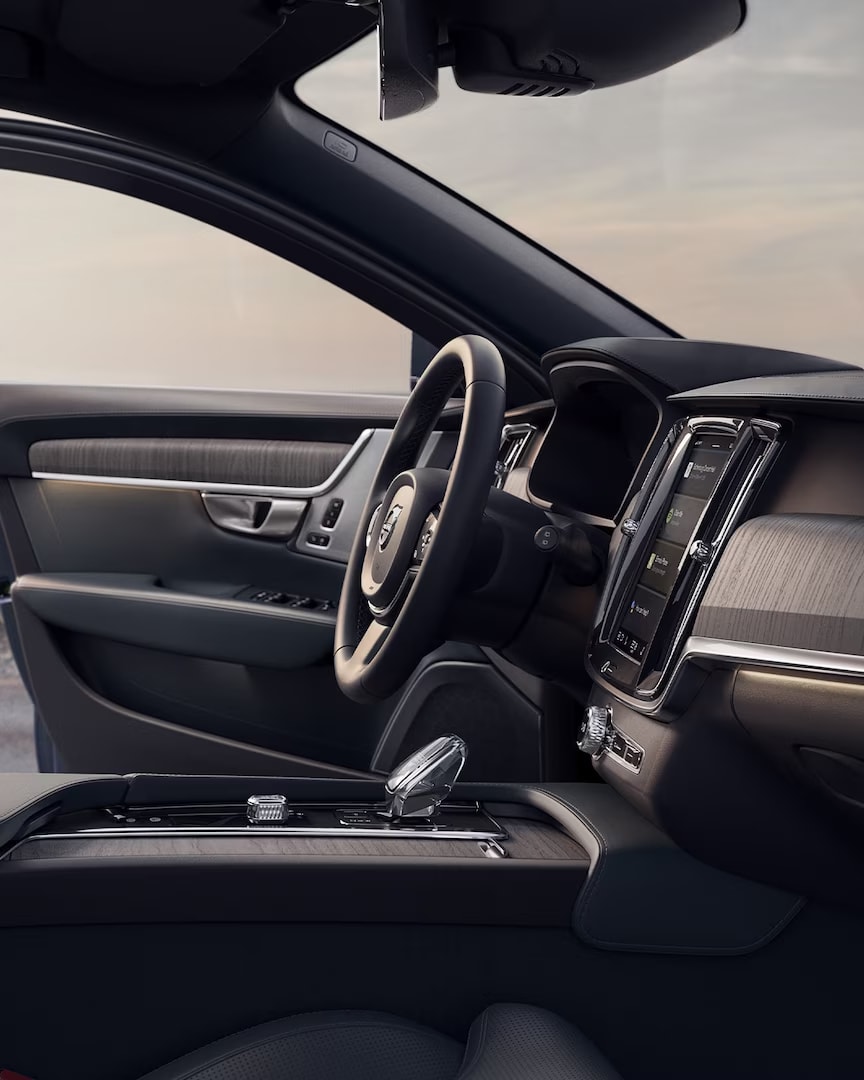 Front interior of Volvo V90 Cross Country with driver door open.