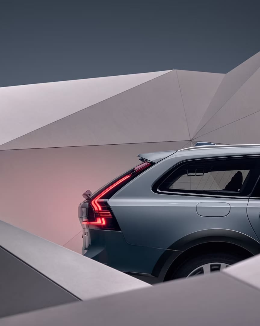 The side of a grey Volvo V90 Cross Country.