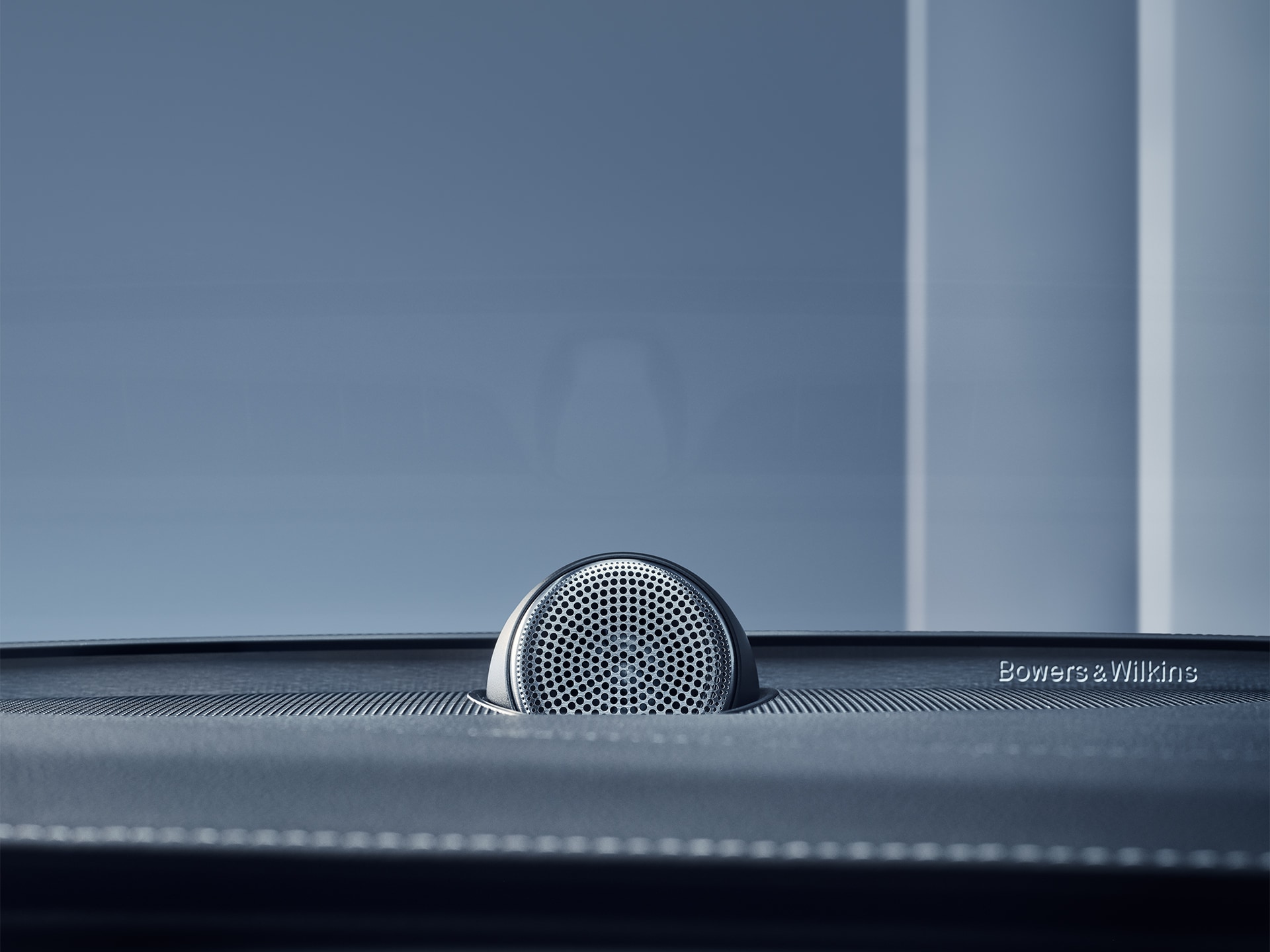 Close-up of a Bowers & Wilkins dashboard speaker in the Volvo XC90 mild hybrid SUV.