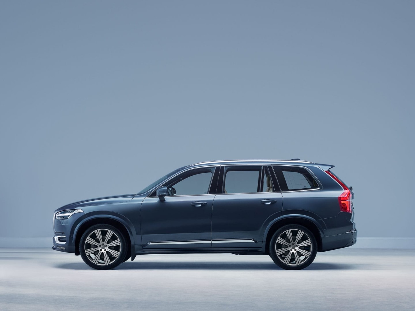 The side profile of a Volvo XC90 SUV.