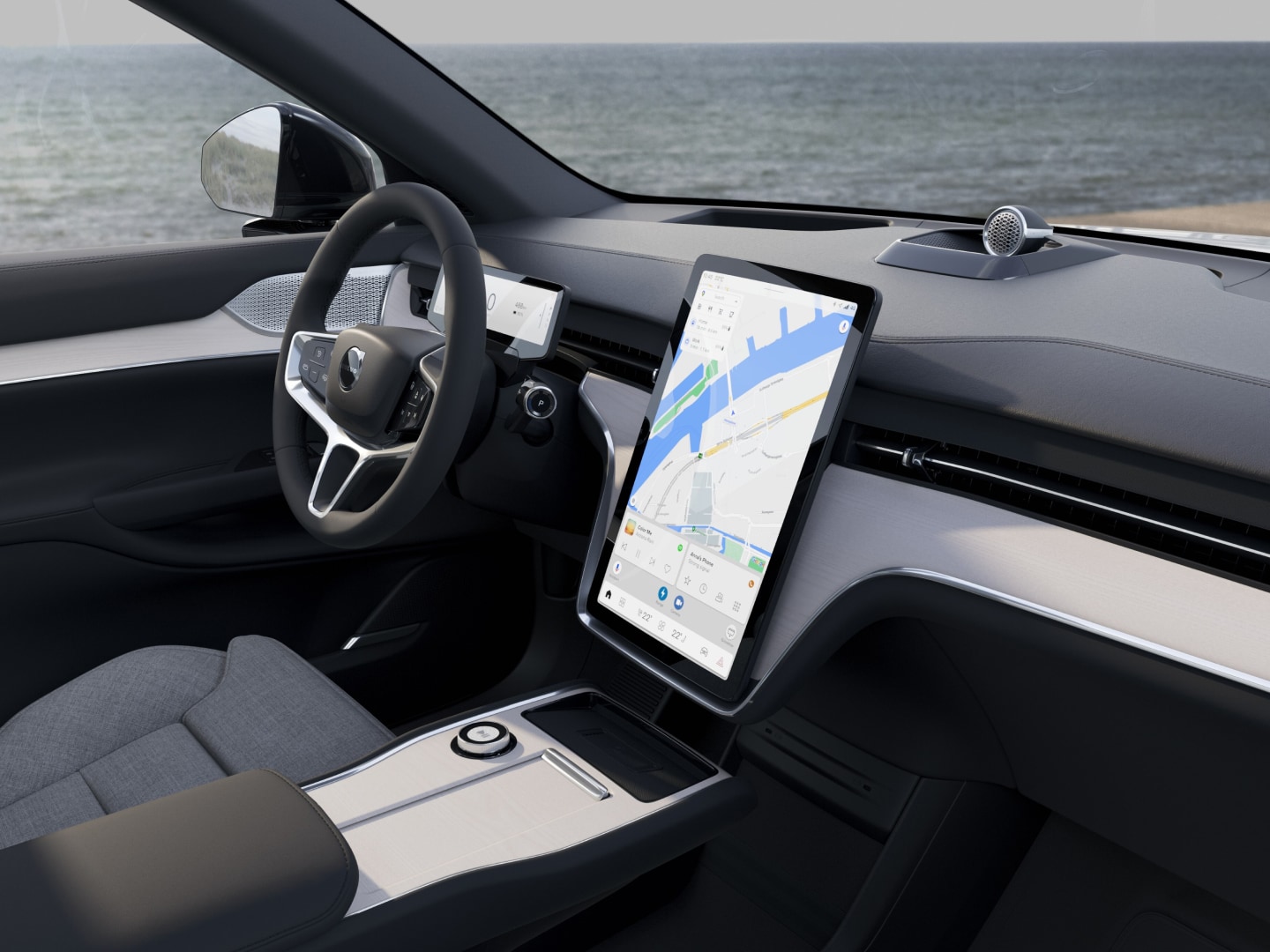 The steering wheel and free-floating centre display in a Volvo EX90 cabin.