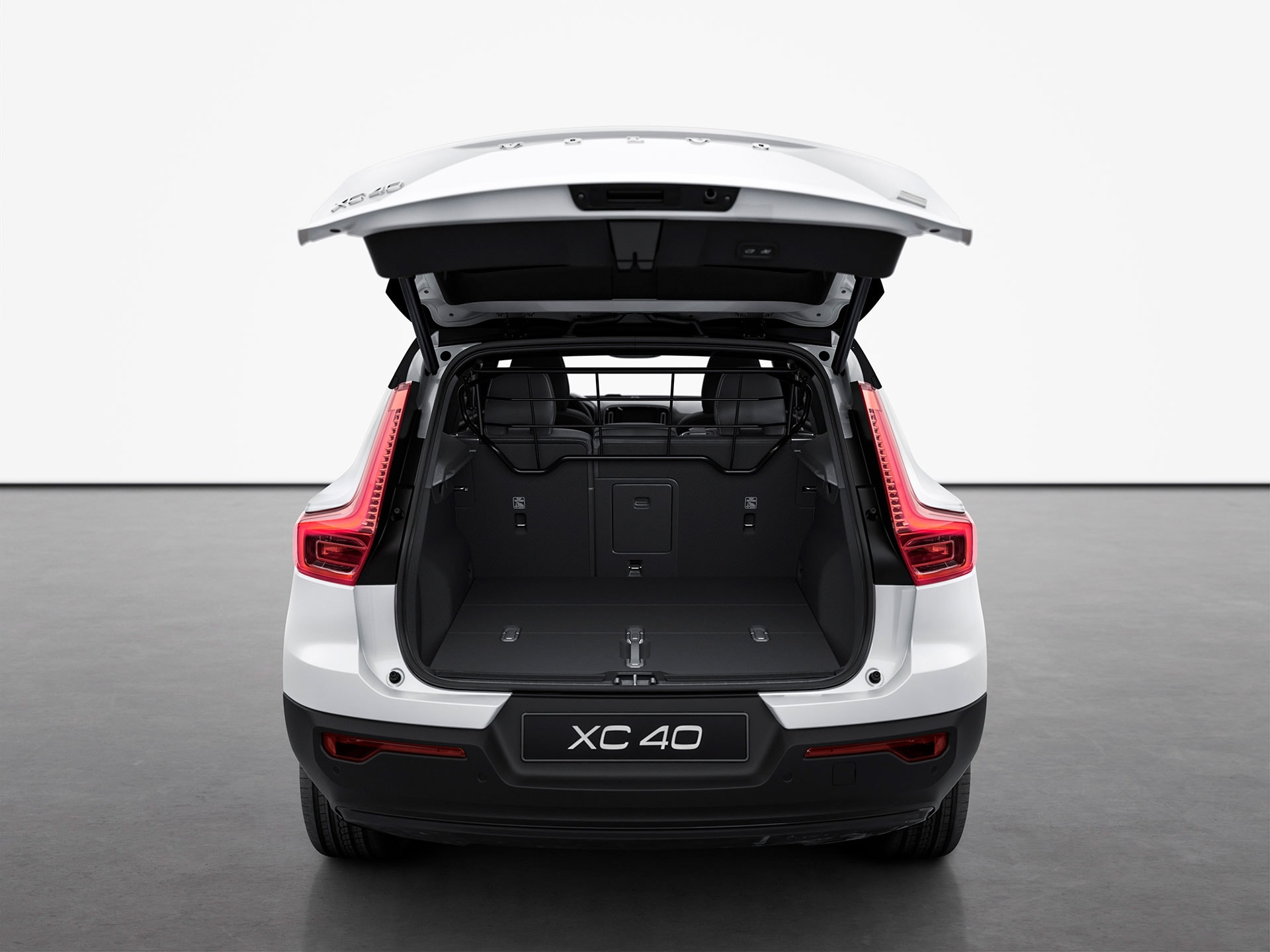 A white Volvo XC40 Recharge seen from rear.
