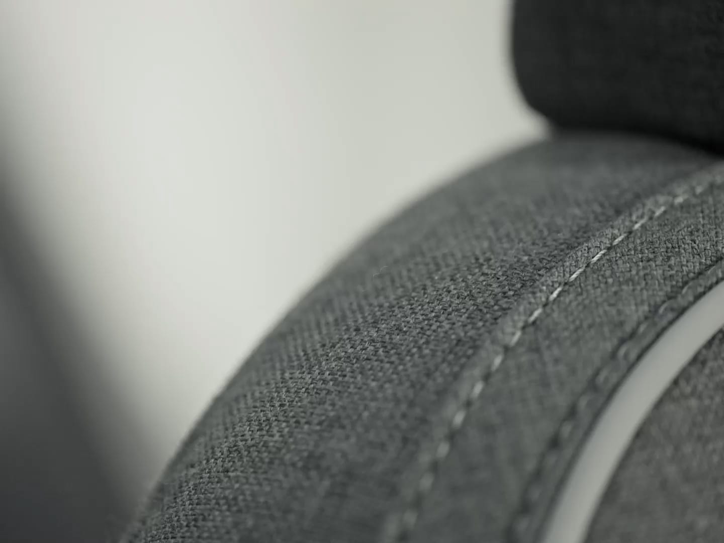 Interior close-up of the Tailored Wool Blend upholstery in the Volvo XC40 Recharge plug-in hybrid.