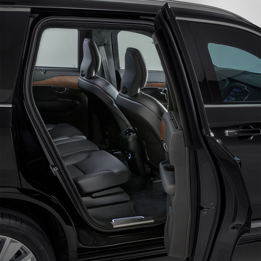 Detail shot of the right rear ingress of the heavy-armoured Volvo XC90 showing parts of the rear seat in Charcoal leather.
