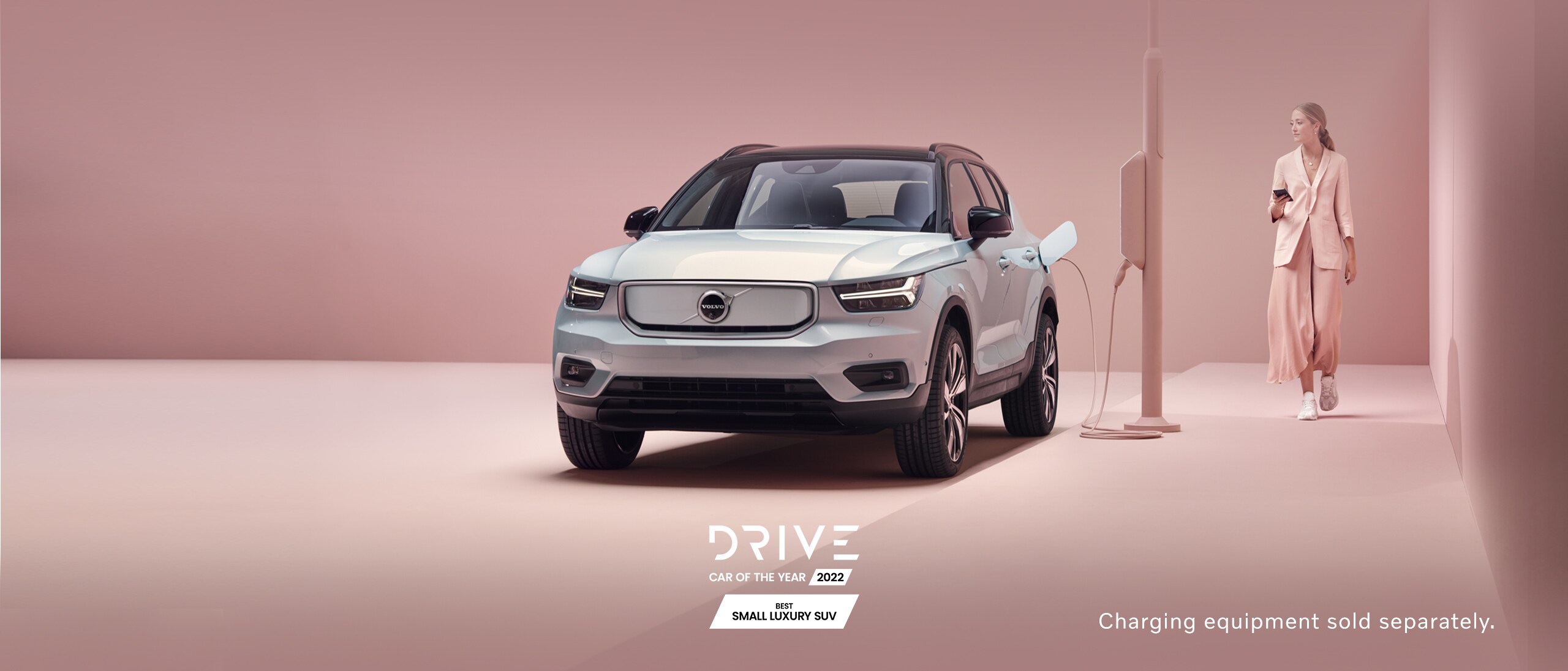 XC40 recharge pure electric SUV parked on street charging.