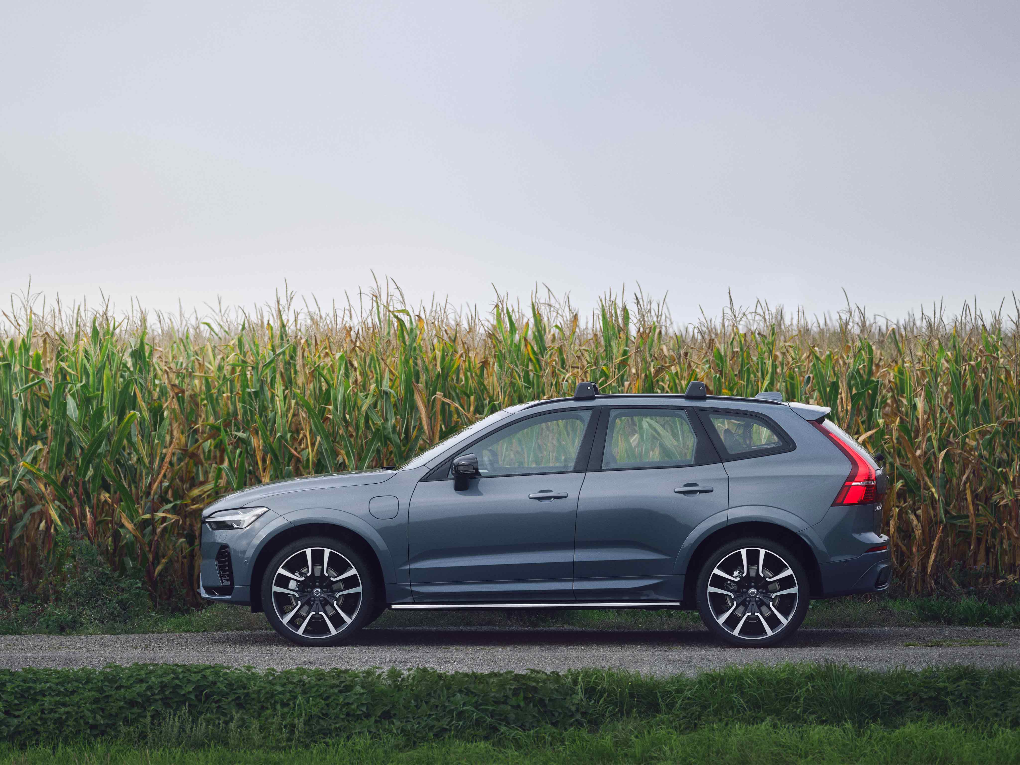 Thunder Grey Volvo XC60 Recharge by a field.