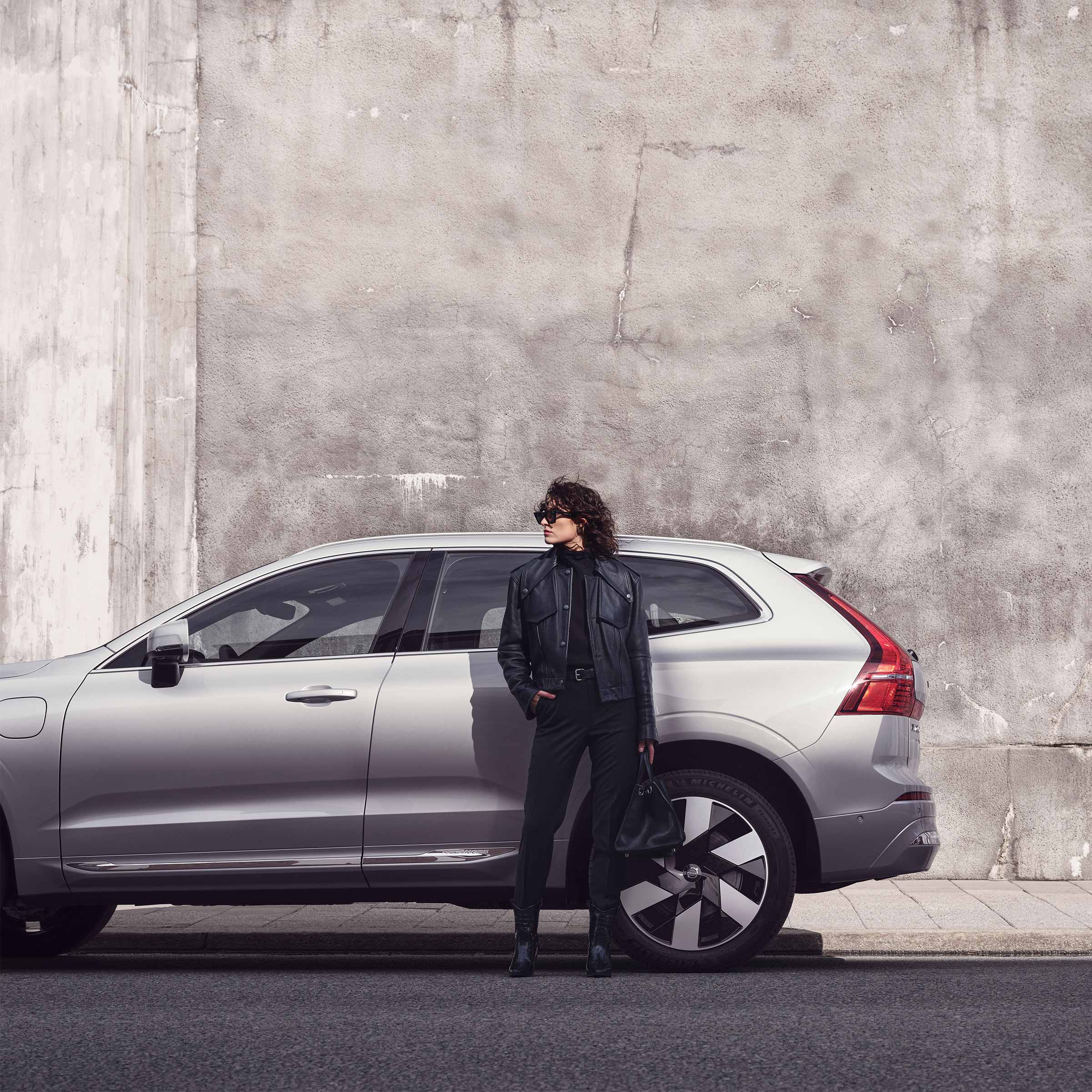Woman standing in front of Silver Grey Volvo XC60