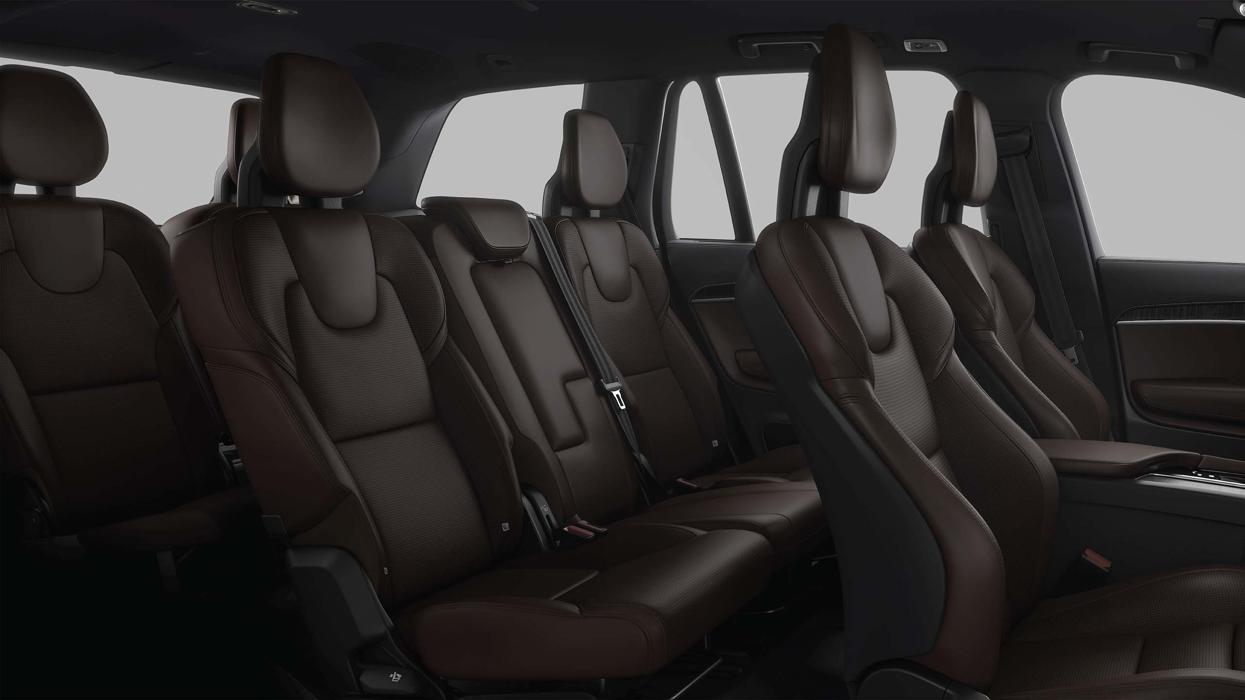 Inside a Volvo XC90 with 3 rows, blonde interior on seats.