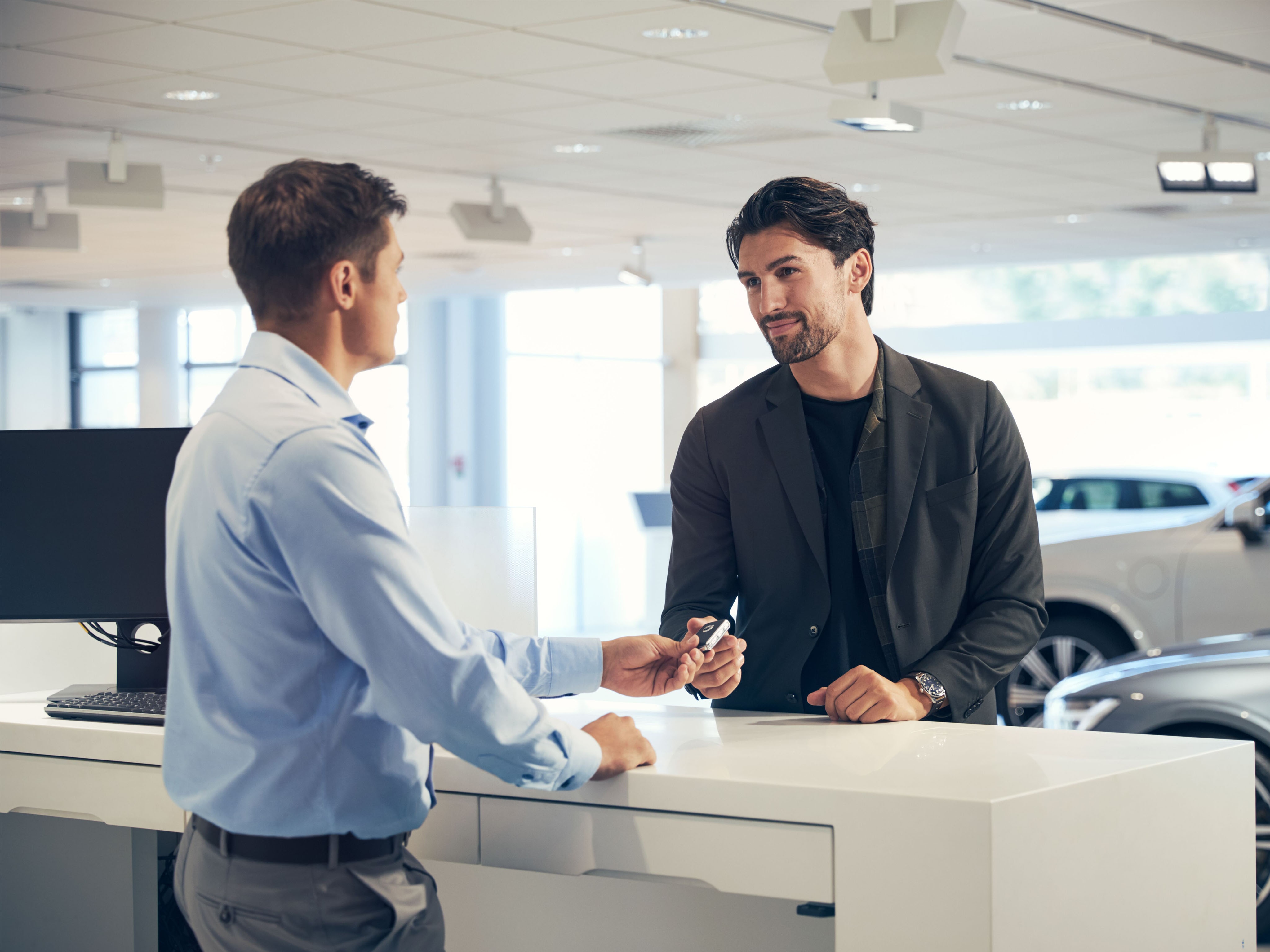 Customer receives loan car keys