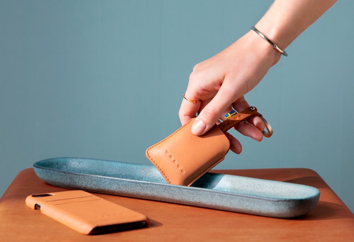 Volvo Lifestyle Collection - Hand putting leather object into tray