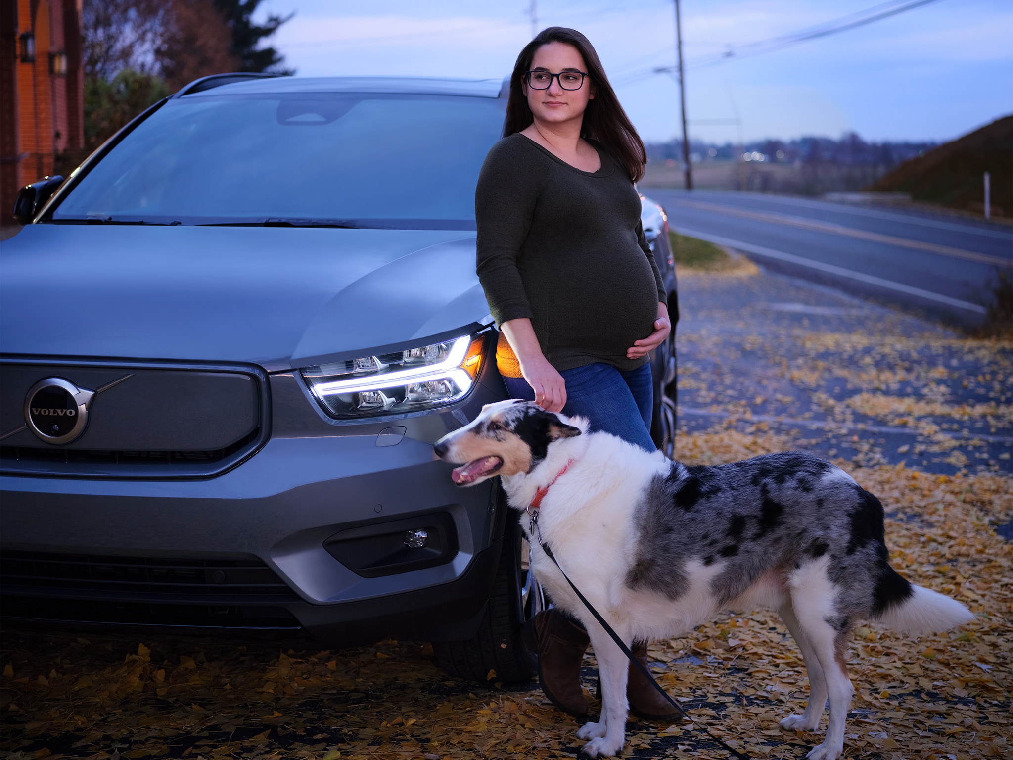 Pregnant Woman with Dog Leaning on Volvo - Volvo Women's Stories Amy B.