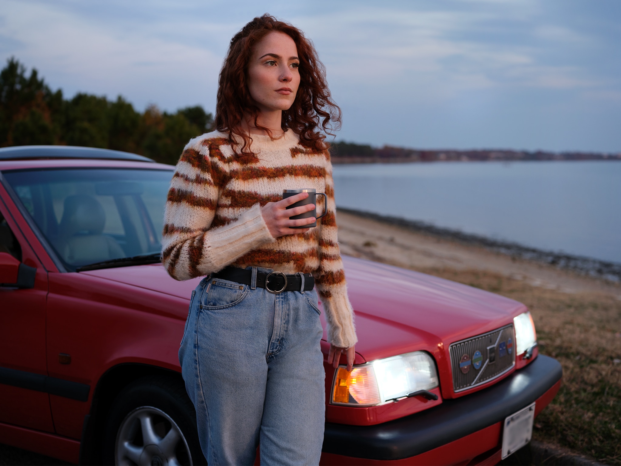Woman in Blue Jeans and Sweater Standing Next to Volvo - Volvo Women's Stories Caroline D.