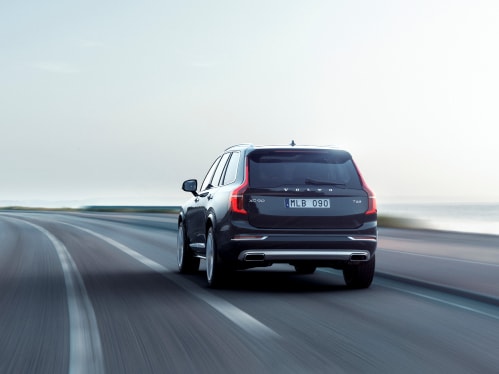 A black Volvo XC90 seen driving from behind.