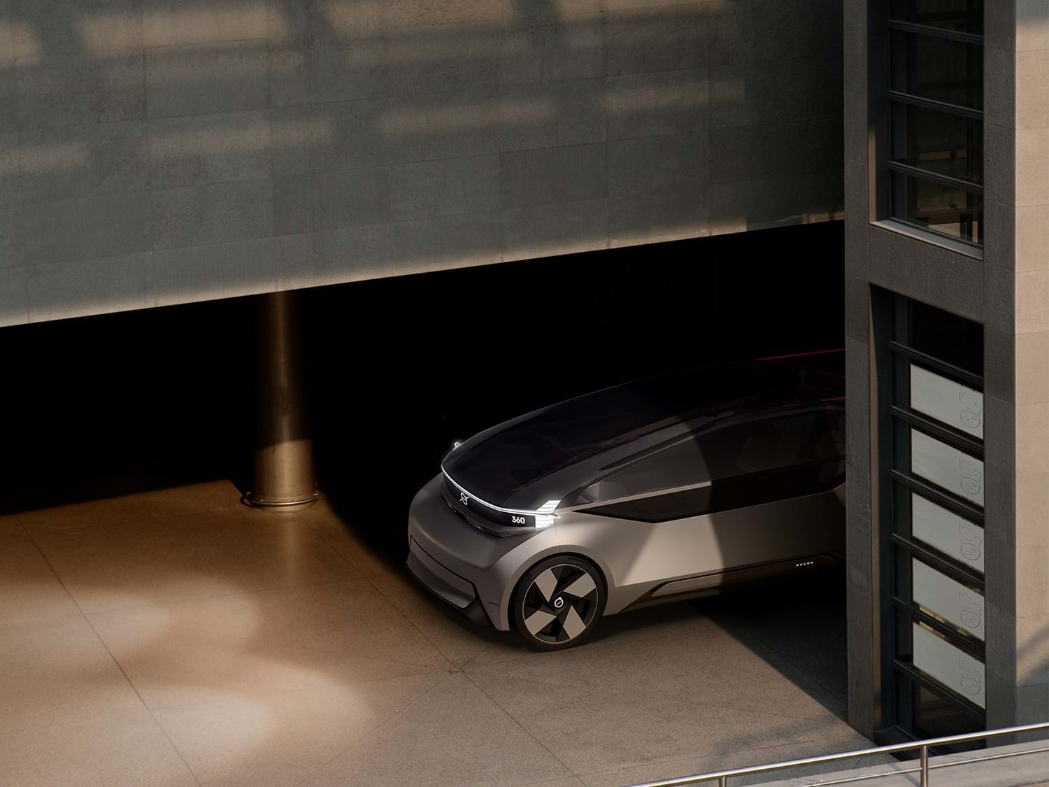 Volvo 360c driving in a parking garage.
