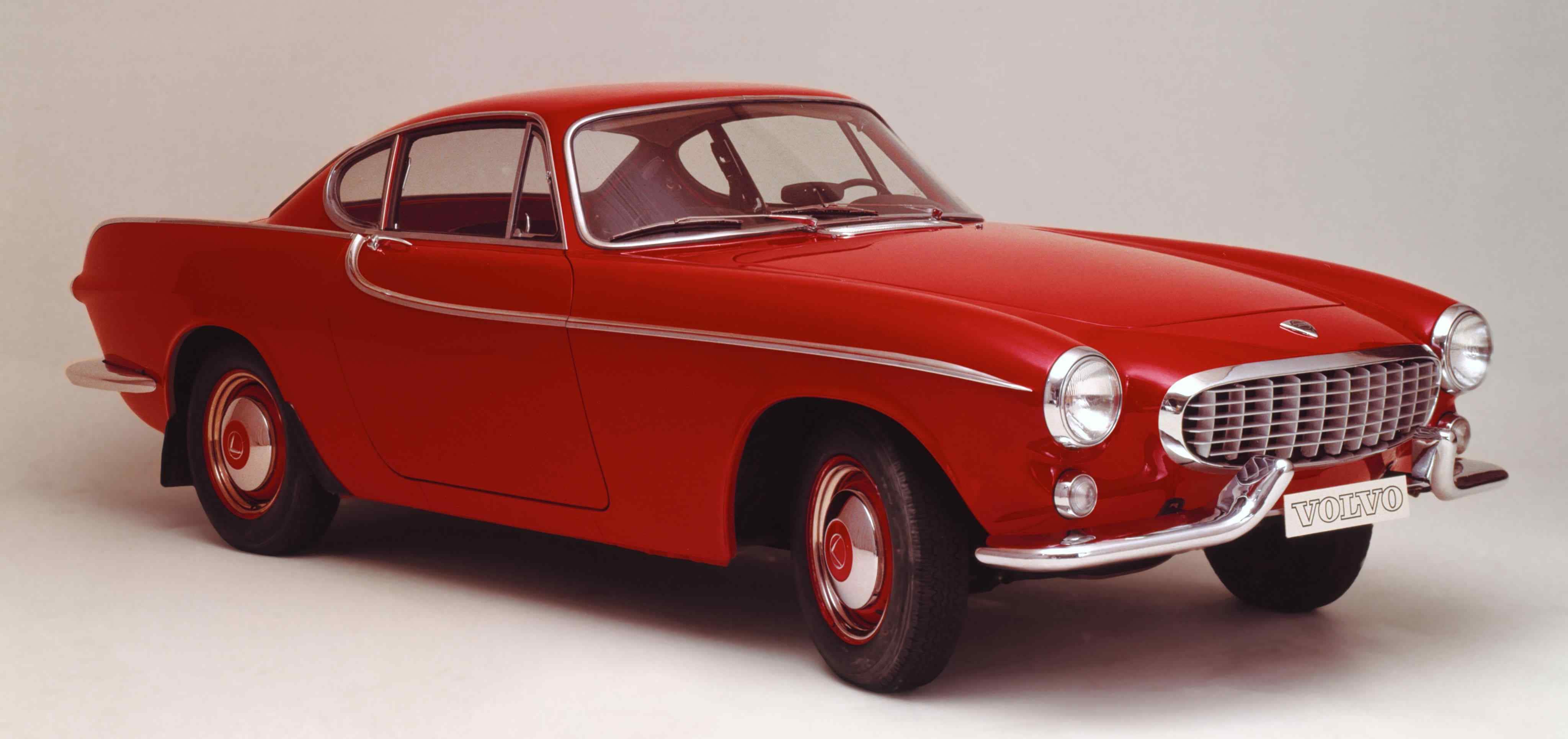 A red Volvo P1800 seen from front left side