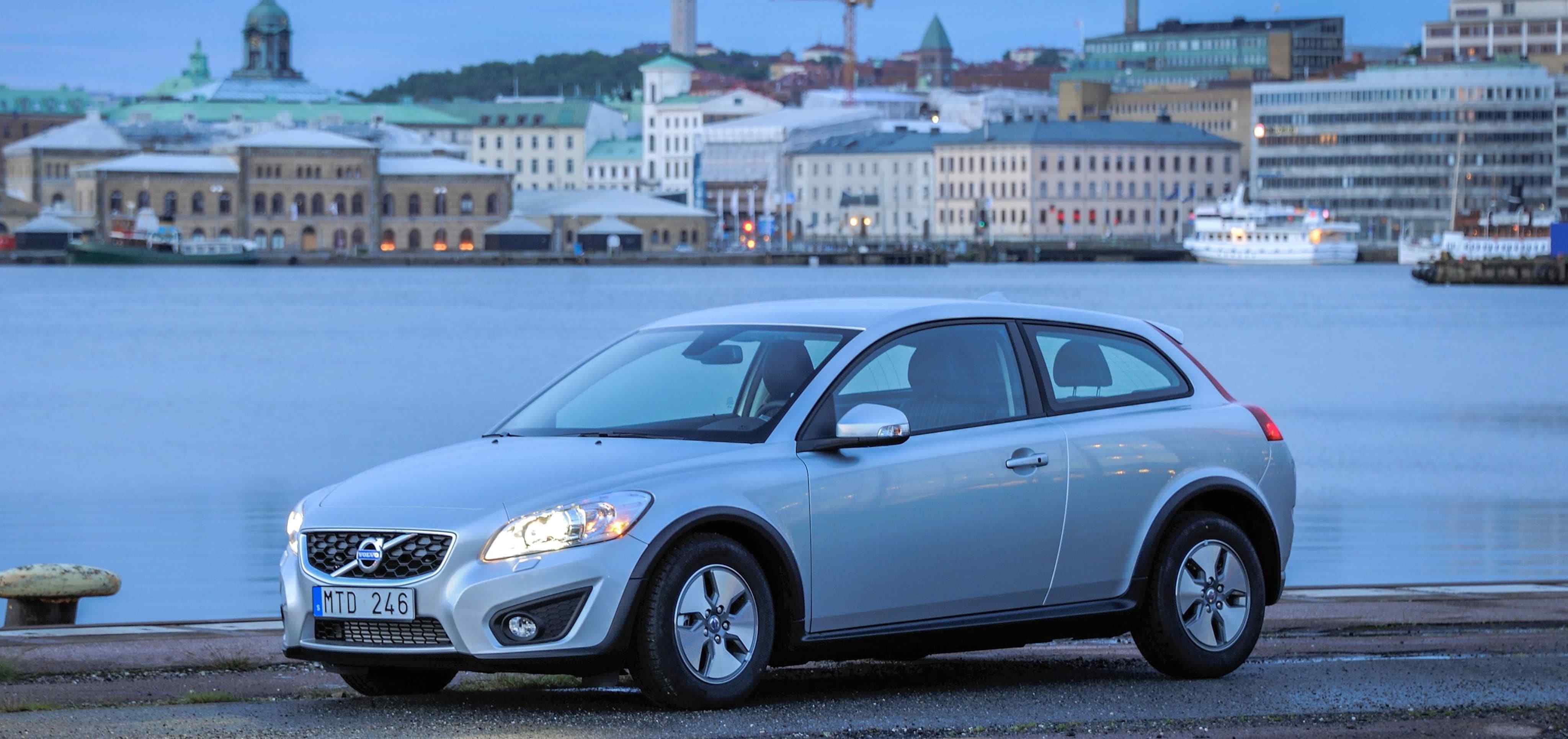 A silver Volvo C30 parked on a quayside