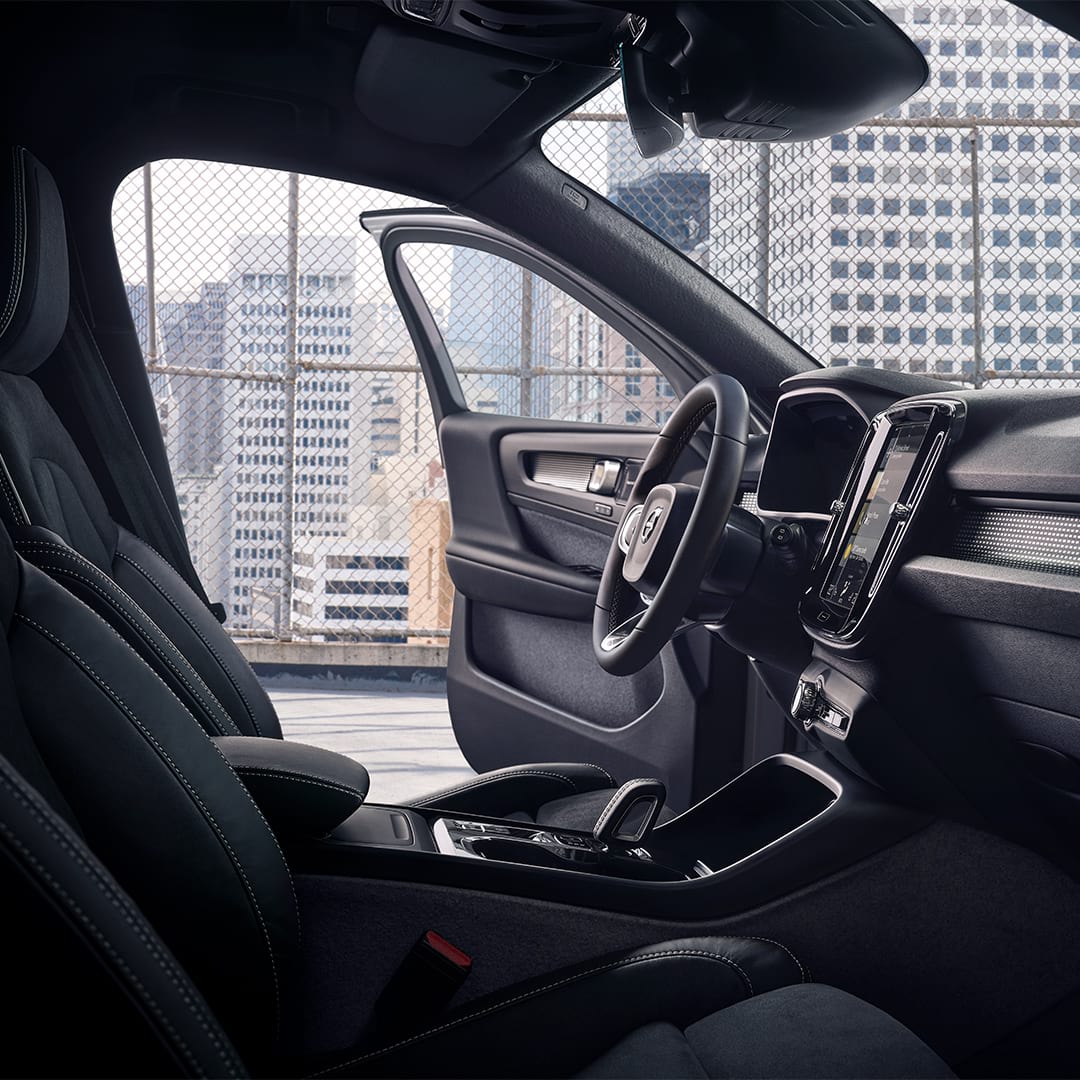 From the inside of a Volvo XC40, the driver's door is open.