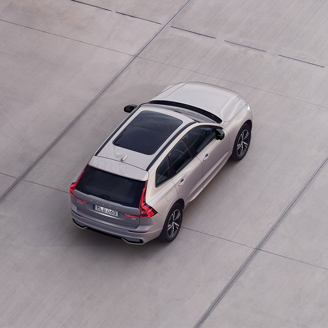 Volvo XC60 seen from high above in outdoor parking area.
