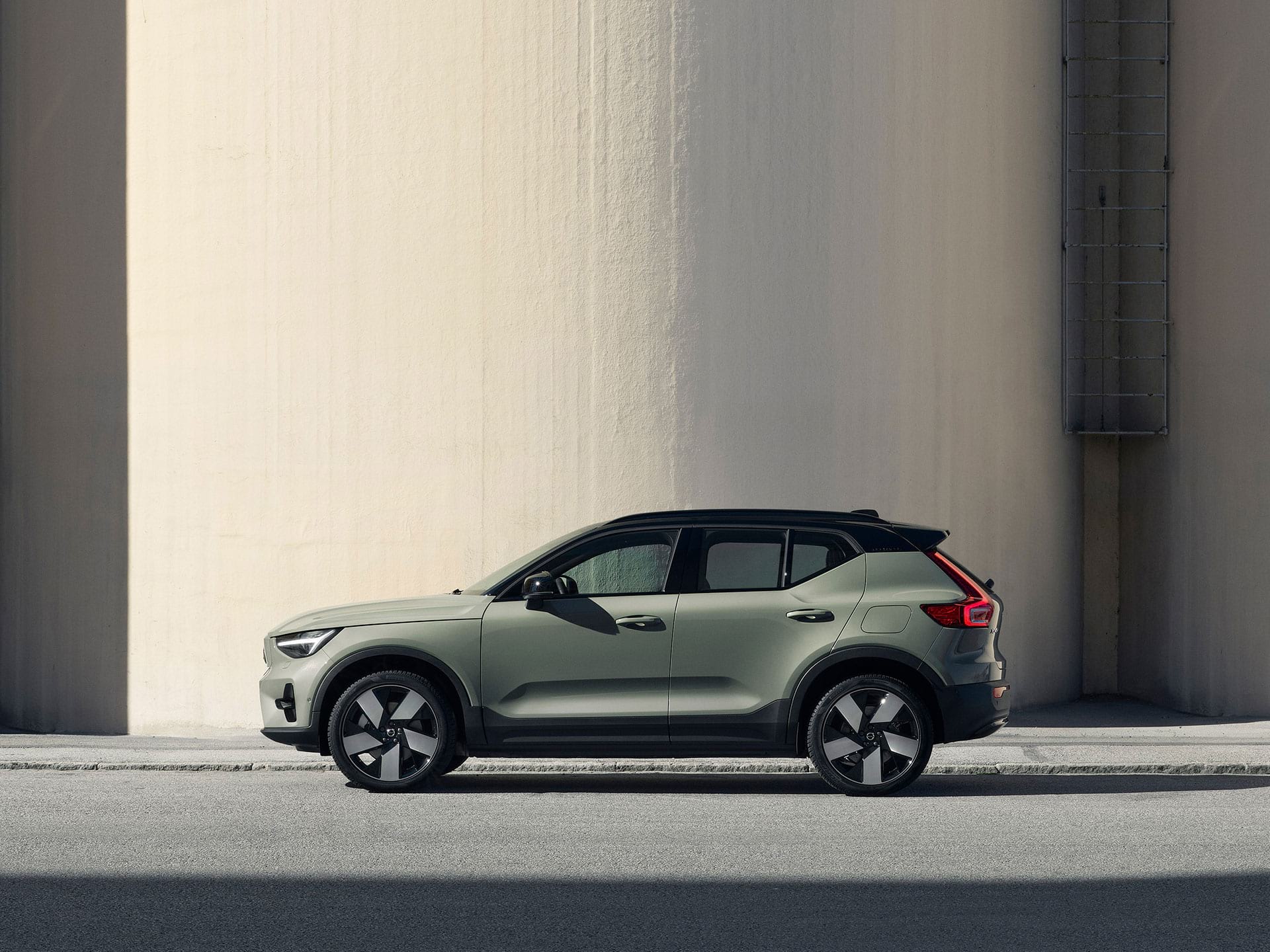 A green Volvo XC40 Recharge pure electric SUV with reimagined design details.