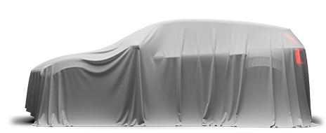 Ein Volvo EX30 ist kunstvoll in einen dünnen weißen Schleier gehüllt, der das Exterieur des Fahrzeugs verdeckt